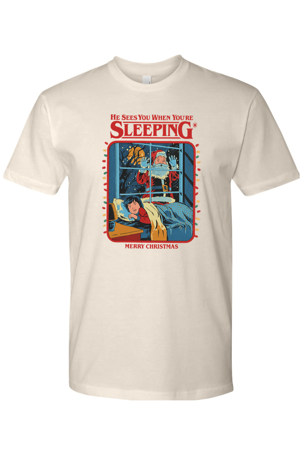 Cream Christmas t-shirt with "He Sees You When You're Sleeping. Merry Christmas" text with Santa peaking through a window design funny sarcastic holiday humor short sleeve shirt