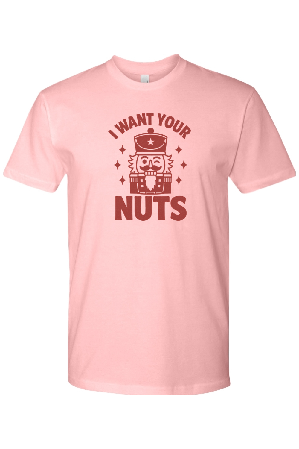 Light pink funny Christmas t-shirt with "I Want Your Nuts" text and a winking nutcracker design sarcastic holiday humor short sleeve shirt
