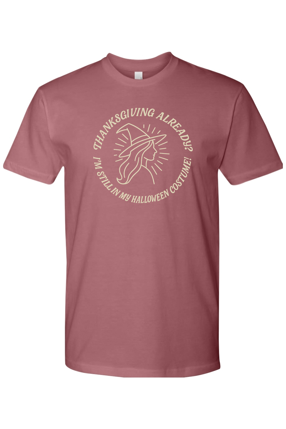 Mauve dark pink Thanksgiving t-shirt with "Thanksgiving Already? I'm Still In My Halloween Costume!" with simple witch design funny fall holiday short sleeve shirt